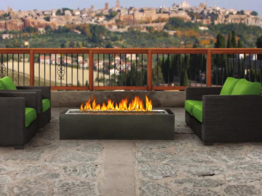 A Napoleon linear Patioflame burner set into a stone surround on a terrace