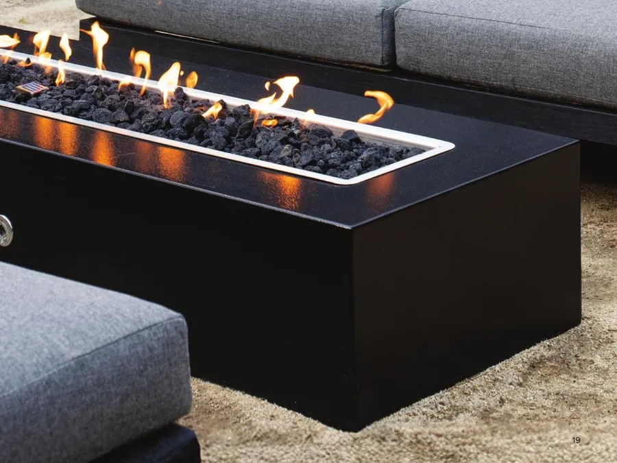 The Outdoor Plus Regal linear fire pit beside an outdoor sectional