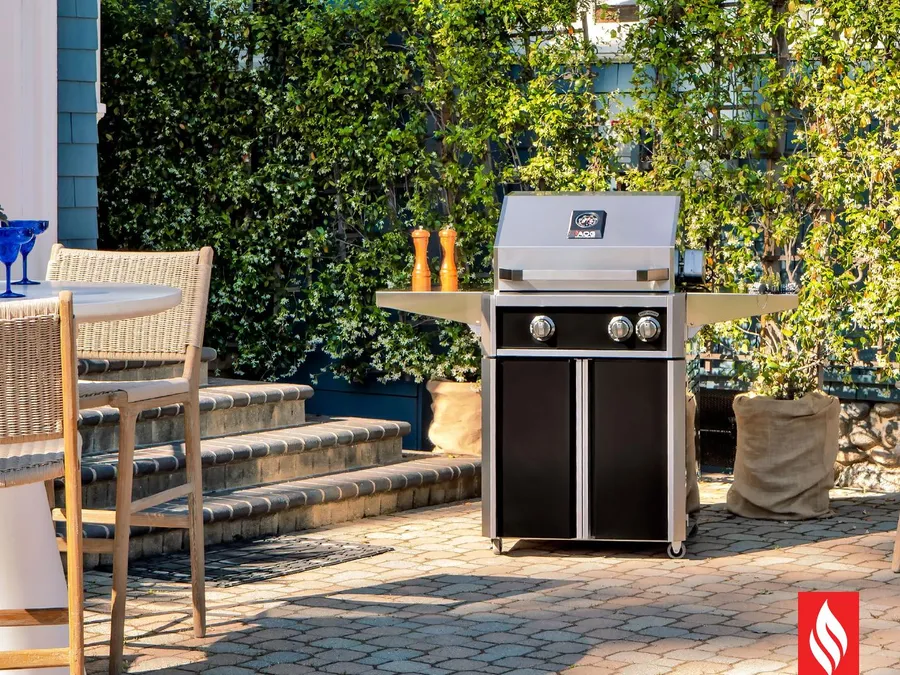 An American Outdoor Grill cart grill on a garden patio