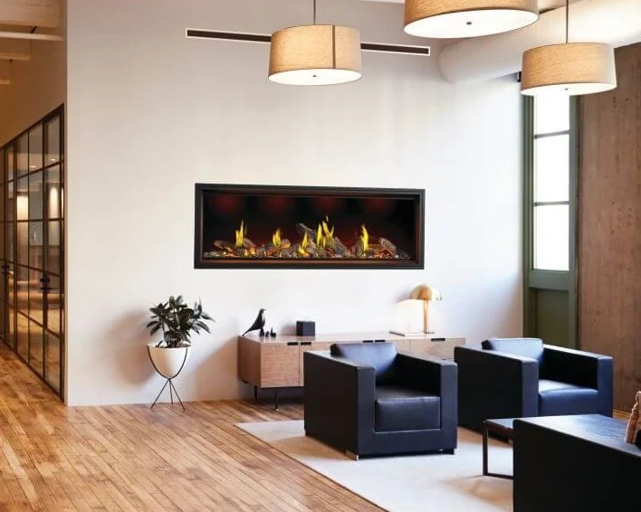 A Napoleon Tall Linear Vector gas fireplace in an office lounge with black leather chairs